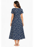 Model wearing ATHLEX SHOP navy blue midi loungewear dress with white leaf print, short sleeves, and flowy fit.
