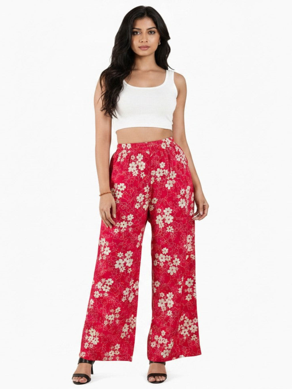 Model wearing ATHLEX SHOP pink floral wide-leg palazzo pants with an elastic waistband and a white crop top.