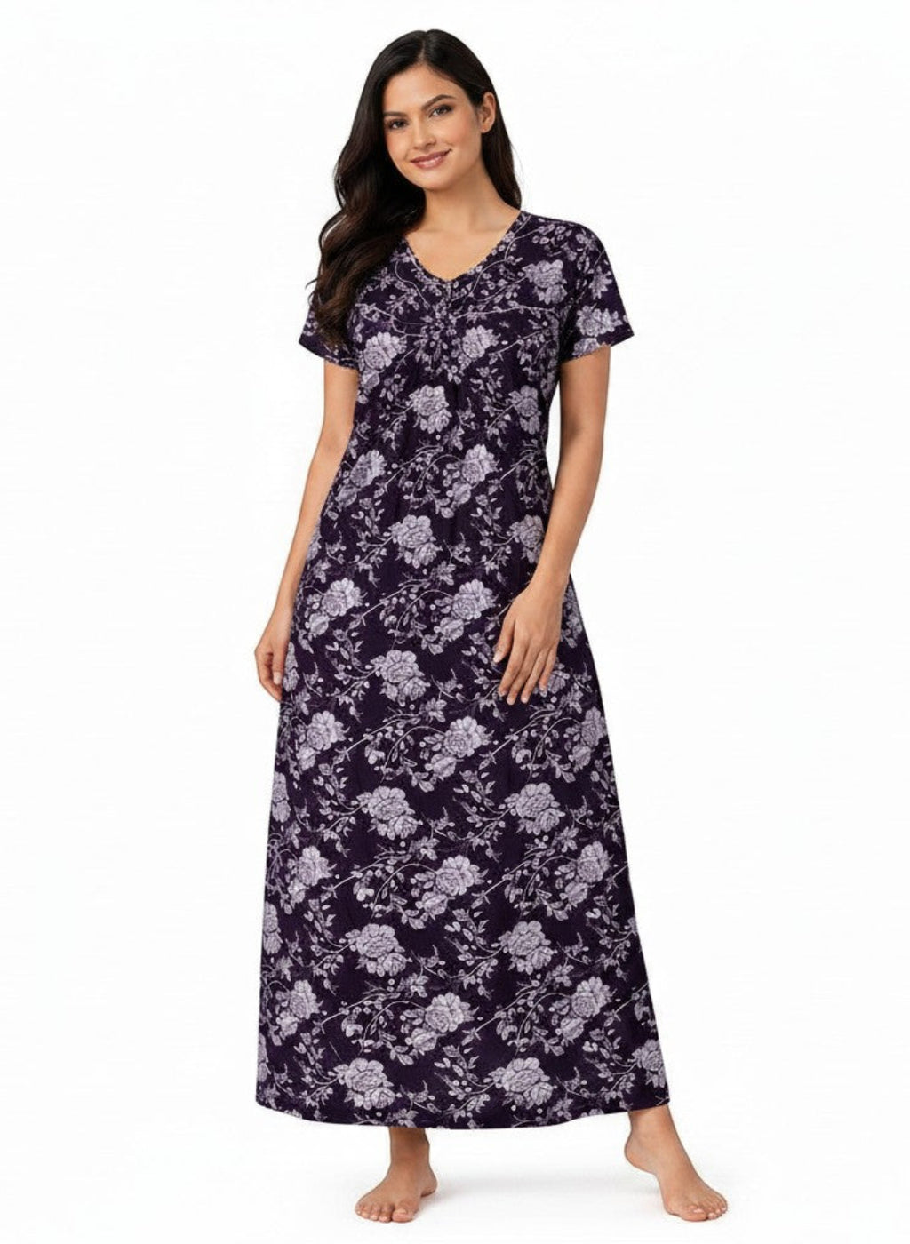 A woman wearing an ATHLEX SHOP Velvet Night Grace full-length nighty with a dark purple floral print and V-neckline.