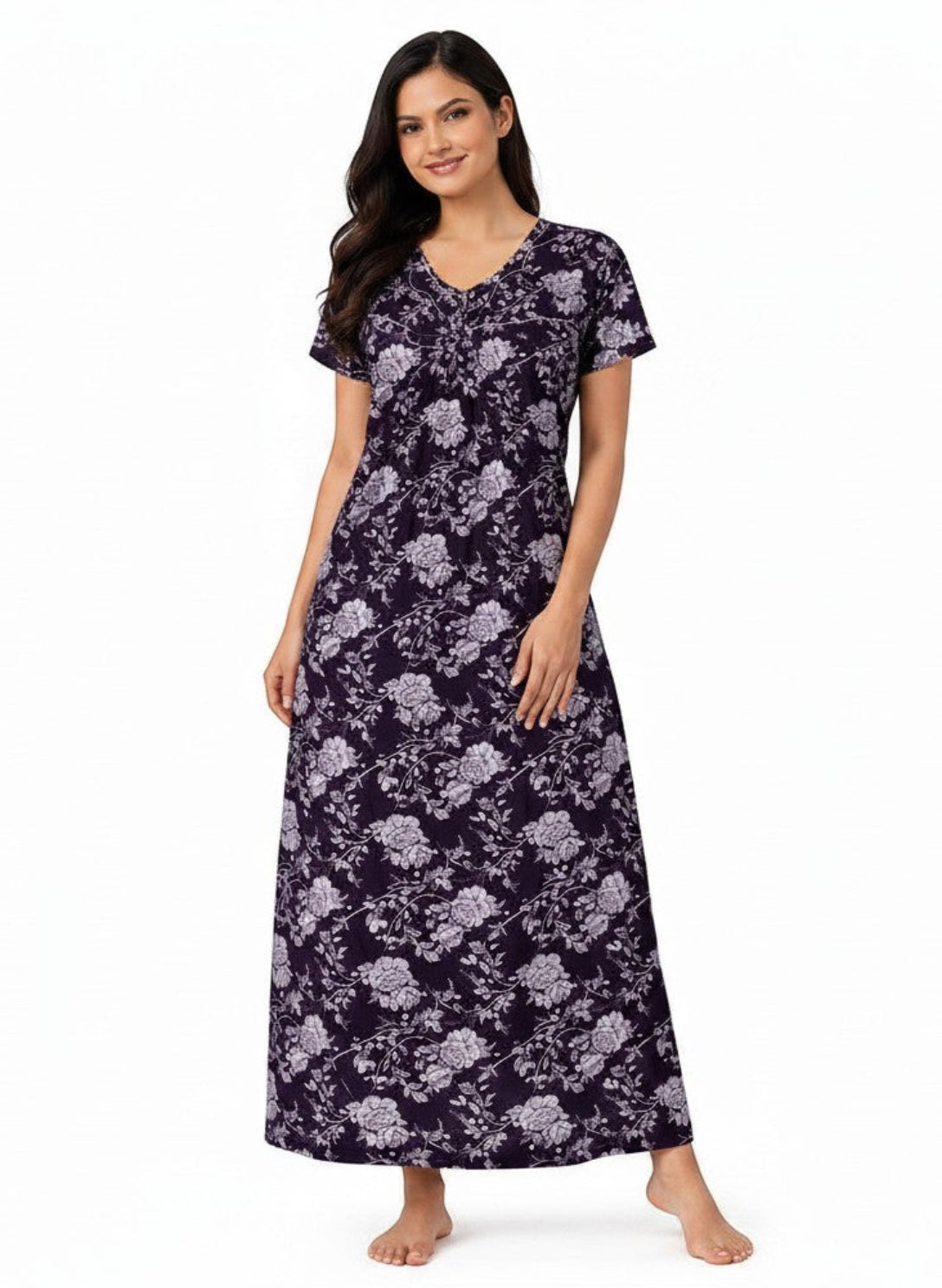 A woman wearing an ATHLEX SHOP Velvet Night Grace full-length nighty with a dark purple floral print and V-neckline.
